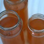Vegetable broth made with scraps vegetable broth in jars