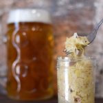 jar of sauerkraut with beer on the back